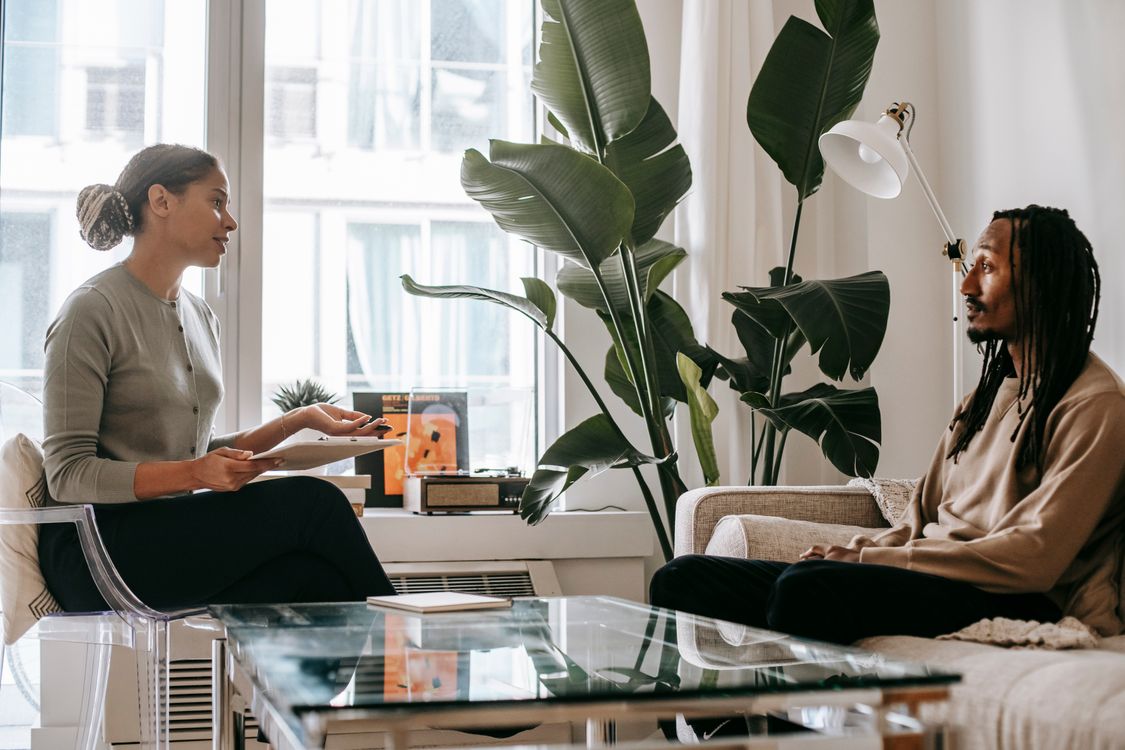 Stock photo of a supportive one-to-one conversation